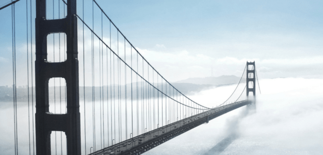 Bridge over a misty river