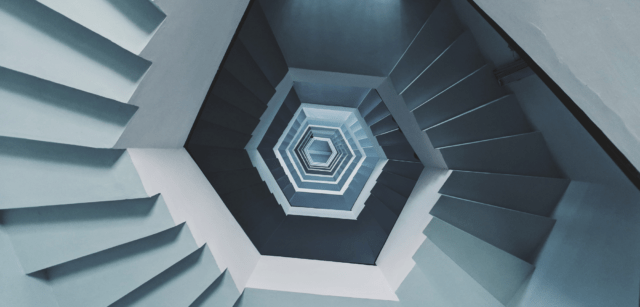 Looking down the centre of a spiral staircase